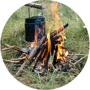A man in a restaurant smiles over a plate of food